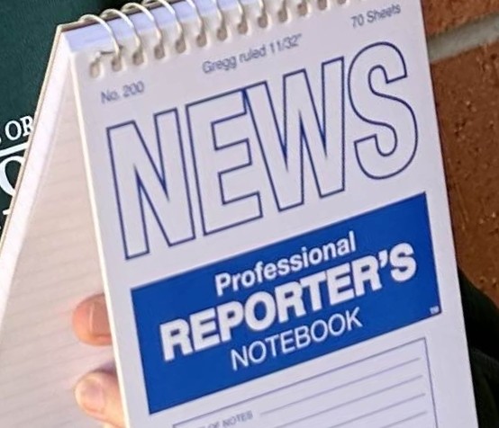 a close up of a reporter's notebook